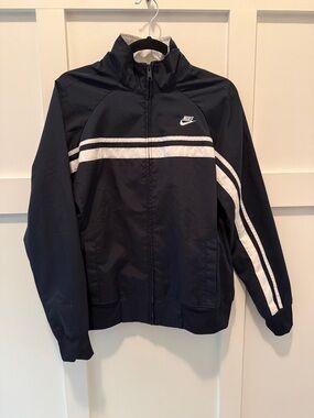 NWT Nike Navy Jacket Full zip
Up with White Stripes and pockets size Large 12-14